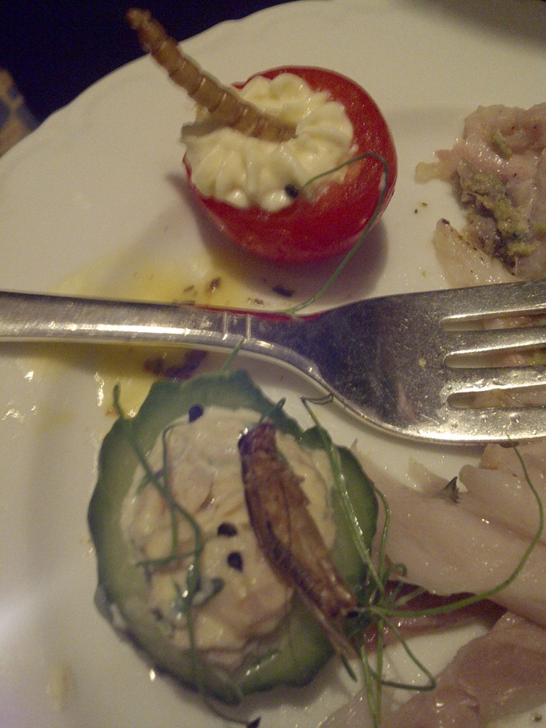 Explorers Club Exotic Food: Cricket Atop a Stuffed Tomato with Crab Salad, Python in a Pepper Sauce and Grubs in a Mushroom Cap